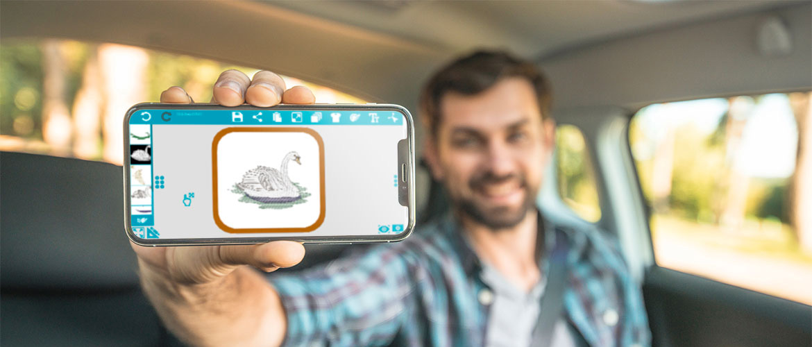 Man-holding-phone-with-Spark-app-in-car