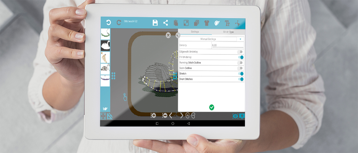 Woman-holding-tablet-with-Spark-embroidery-software-app